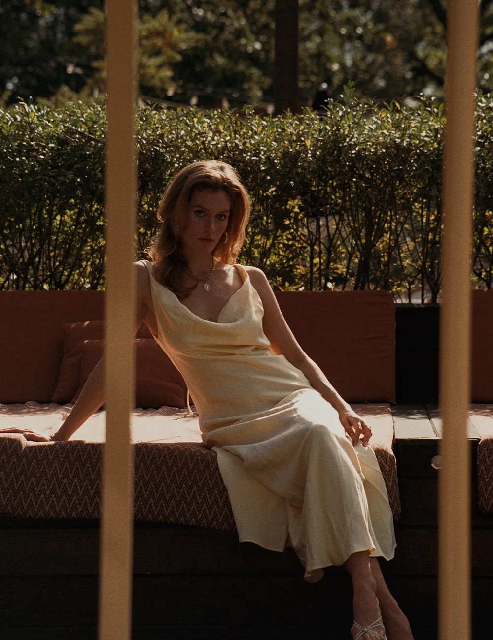 Sunny afternoon at Ellery Beach House Woman in a yellow dress on the terrace at Ellery Beach House on a sunny day