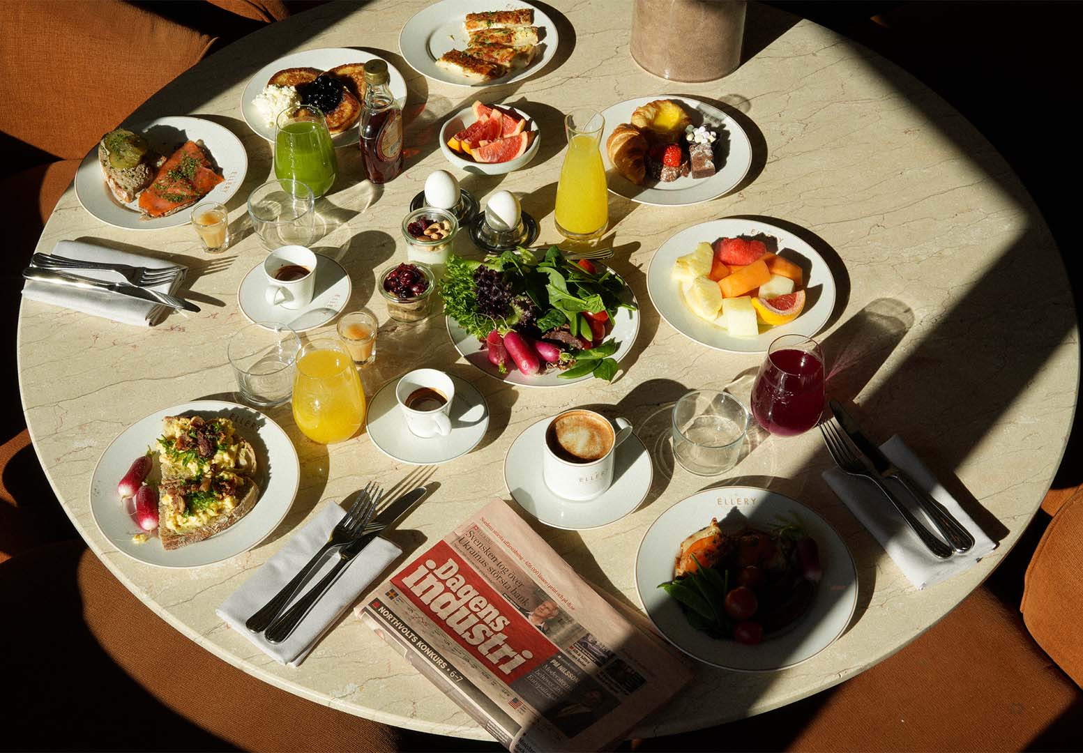Breakfast at Ellery Beach House near Stockholm with juice, coffee and breakfast dishes. Book a table at Palmers.