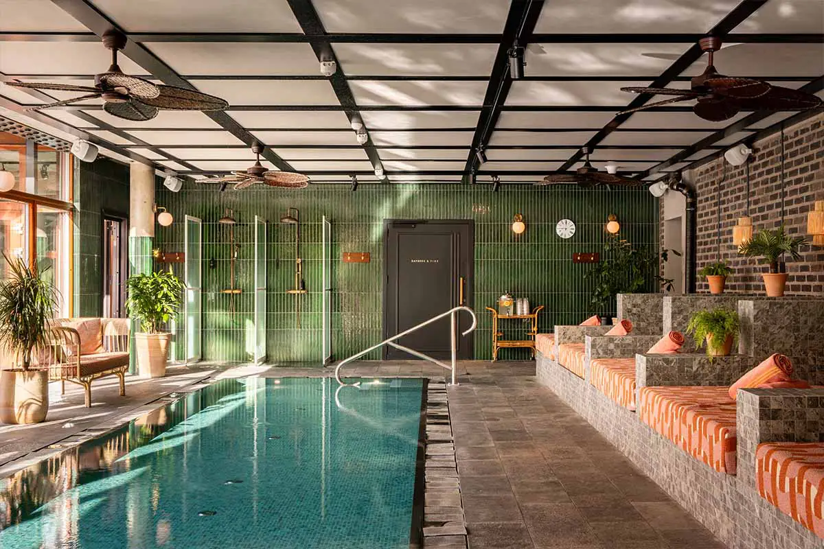 Indoor pool and lounge area at Coco Beach Club at Ellery Beach House in Stockholm.