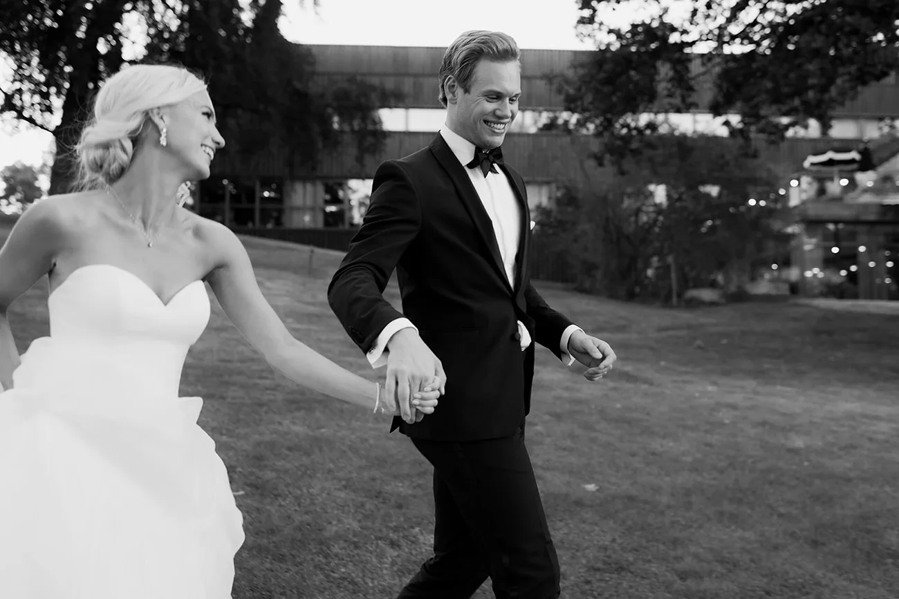 Bride and groom outside Ellery Beach House during a wedding celebration near Stockholm